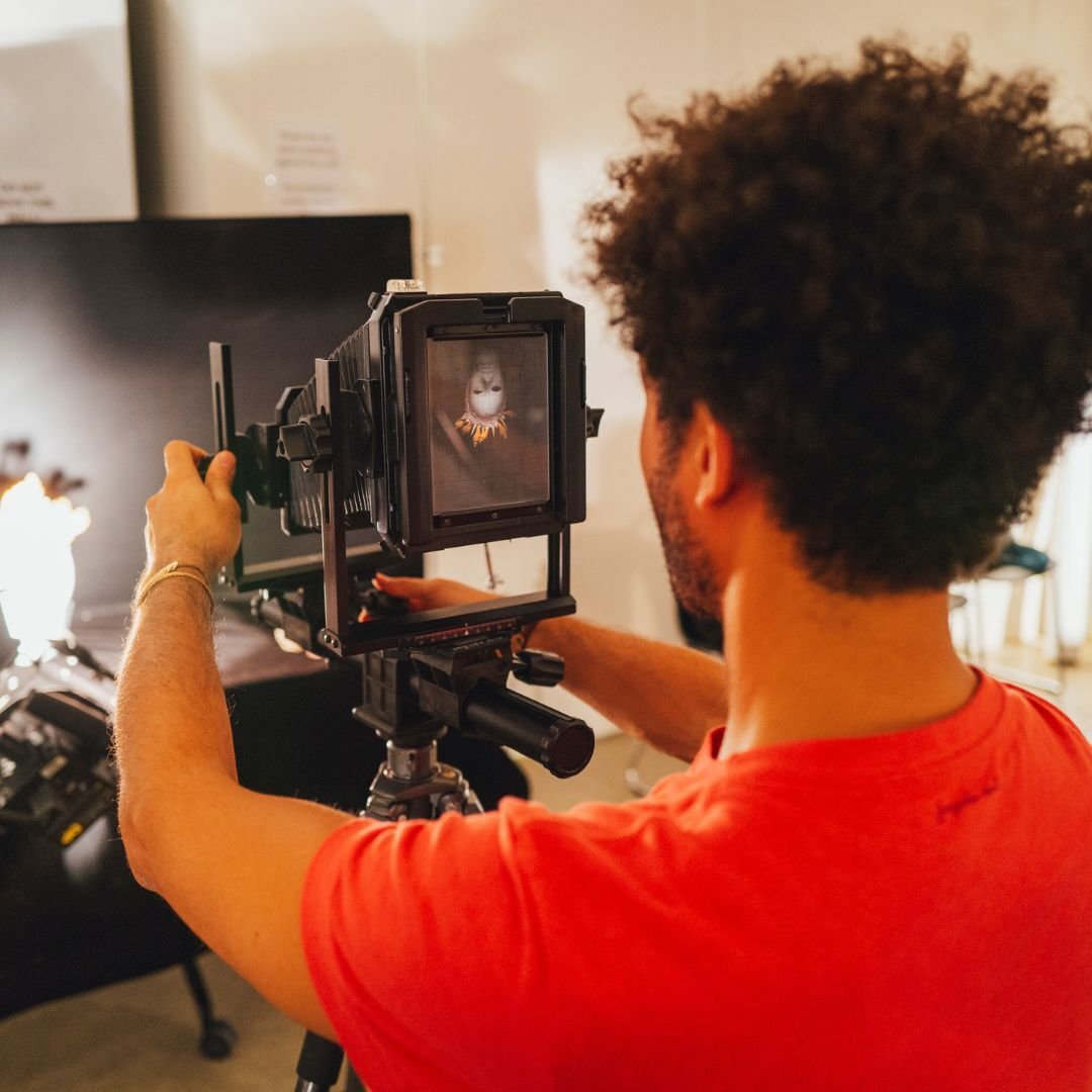 Student using a large format camera in ICP's studio